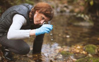 Scientist gathering water sample